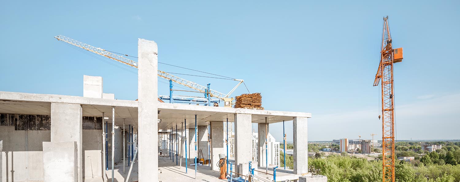 New commercial building under construction with crane.