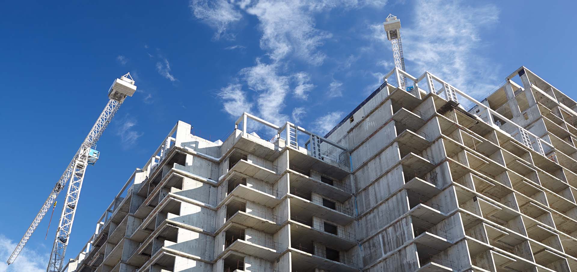 New building under construction with cranes